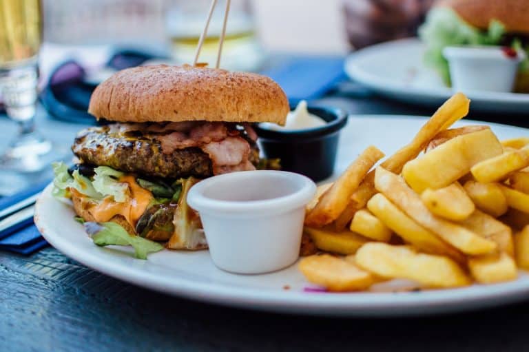 Why are the less healthy food choices typically cheaper? Picture of Burger and Fries