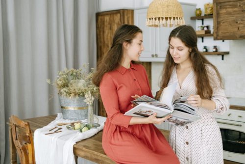 2 Women reading a Cookbook